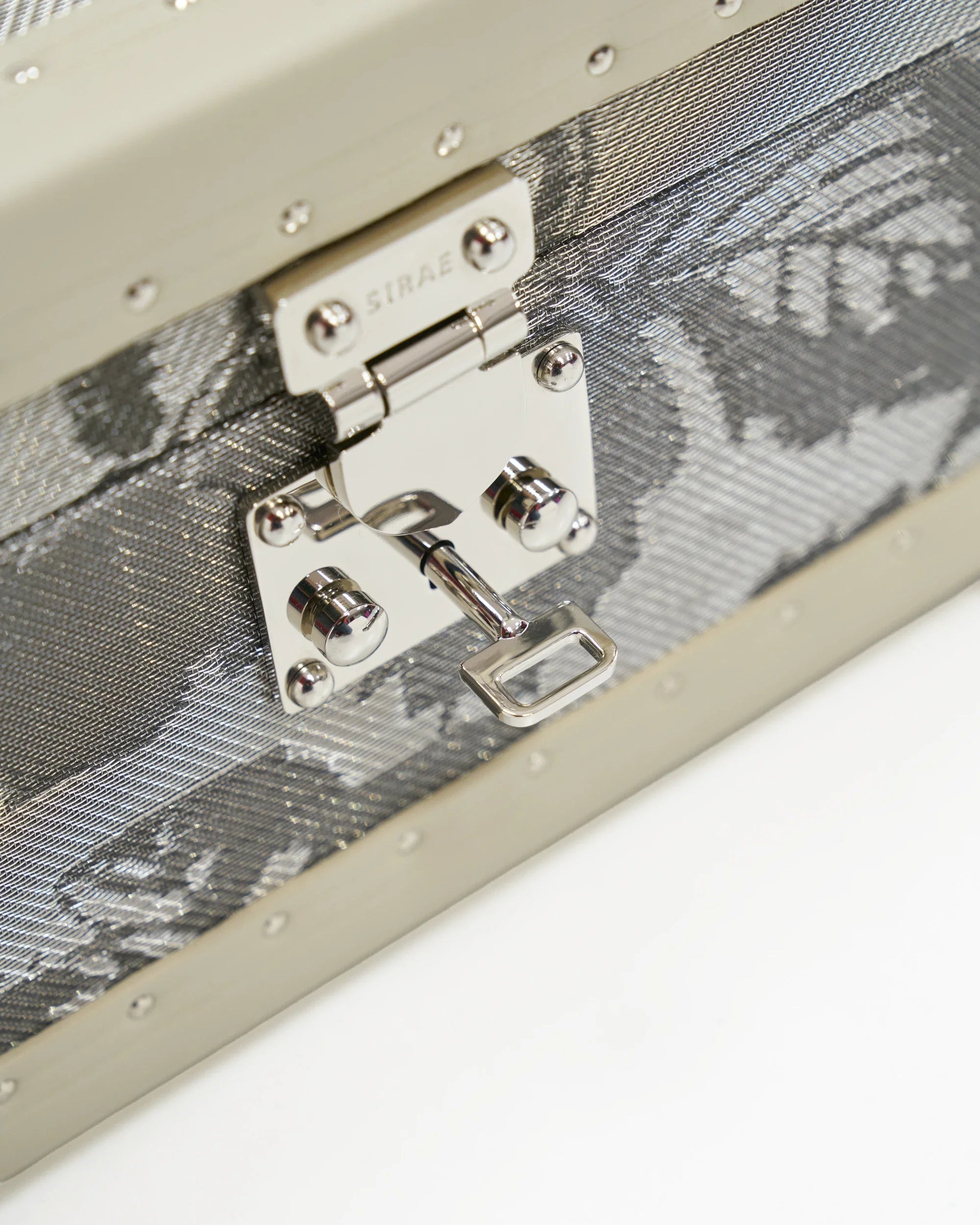 SIRAE Aurum Loom grey petal jewelry box styled with jewelry in a luxury Dubai interior