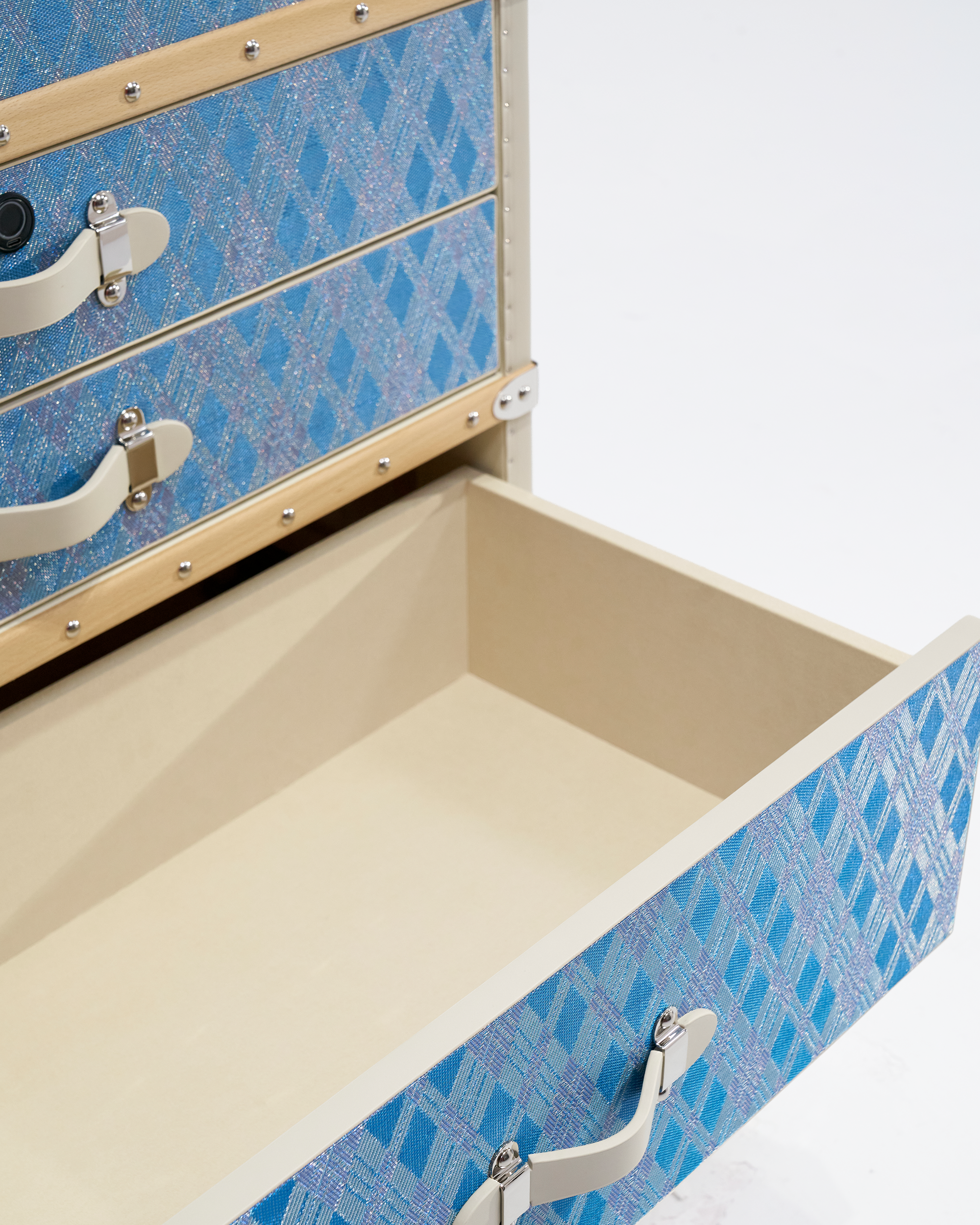 Side view of the SIRAE Aurum Loom diamond mist blue jewelry cabinet in a luxury Dubai setting