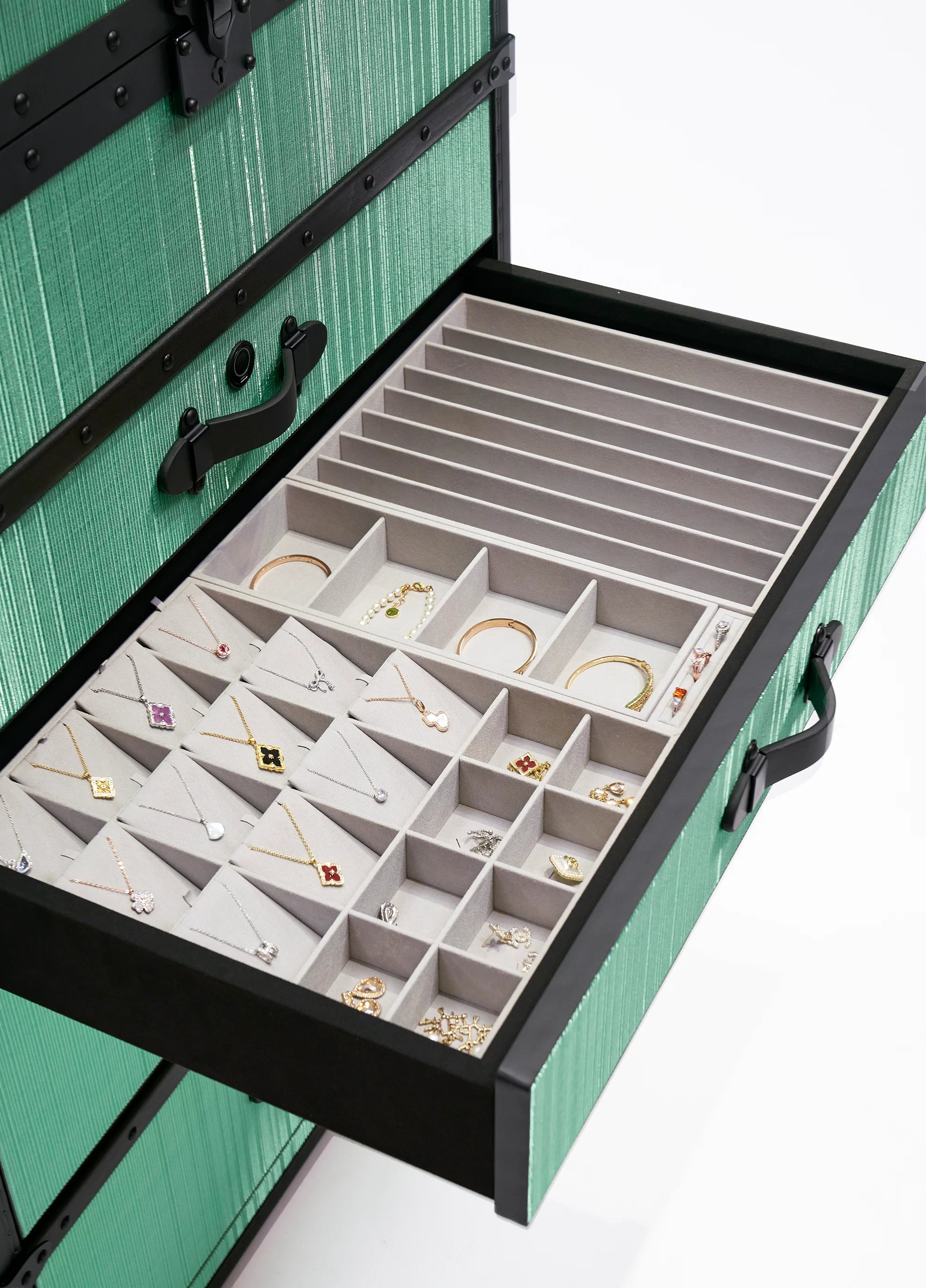 Side view of the SIRAE Aurum Loom celadon mist jewelry trunk in a luxury Dubai setting