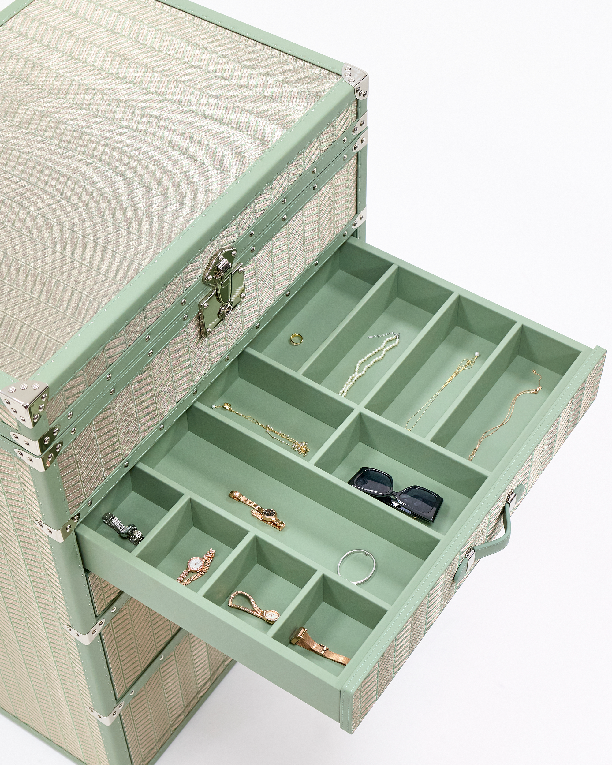 Velvet-lined interior of the SIRAE Aurum Loom emerald jewelry trunk, styled for luxury storage