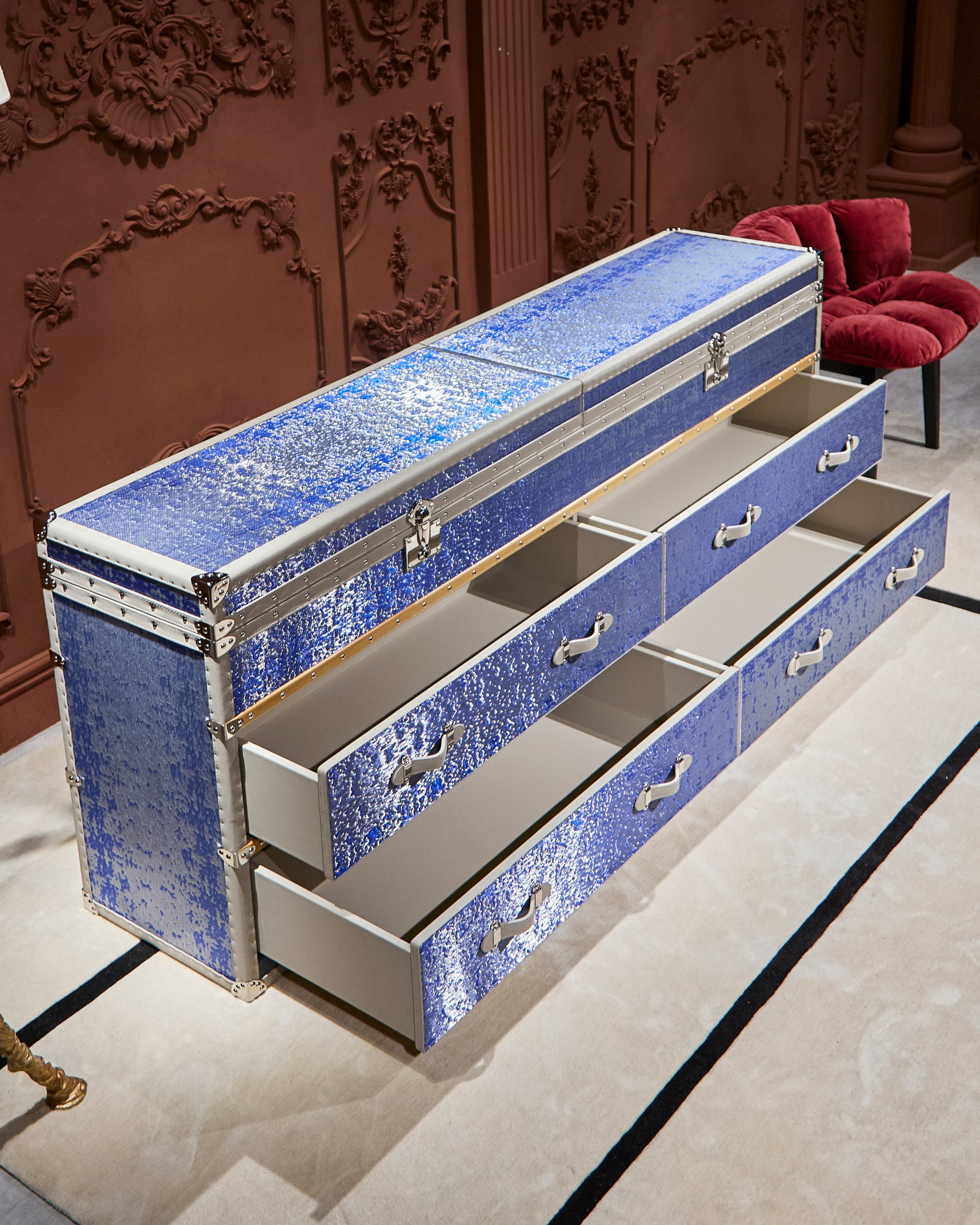 Side view of the SIRAE Aurum Loom azure blue side cabinet in a luxury Dubai setting