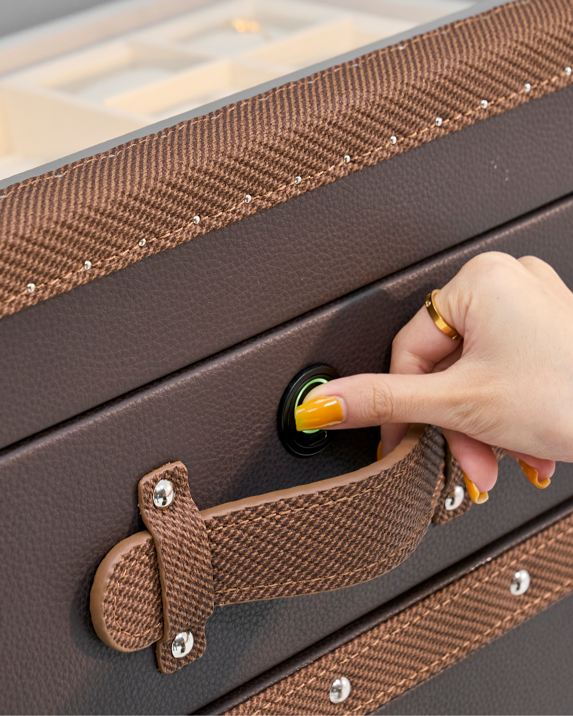SIRAE Heritage Luxe brown side cabinet styled with jewelry in a luxury Dubai interior