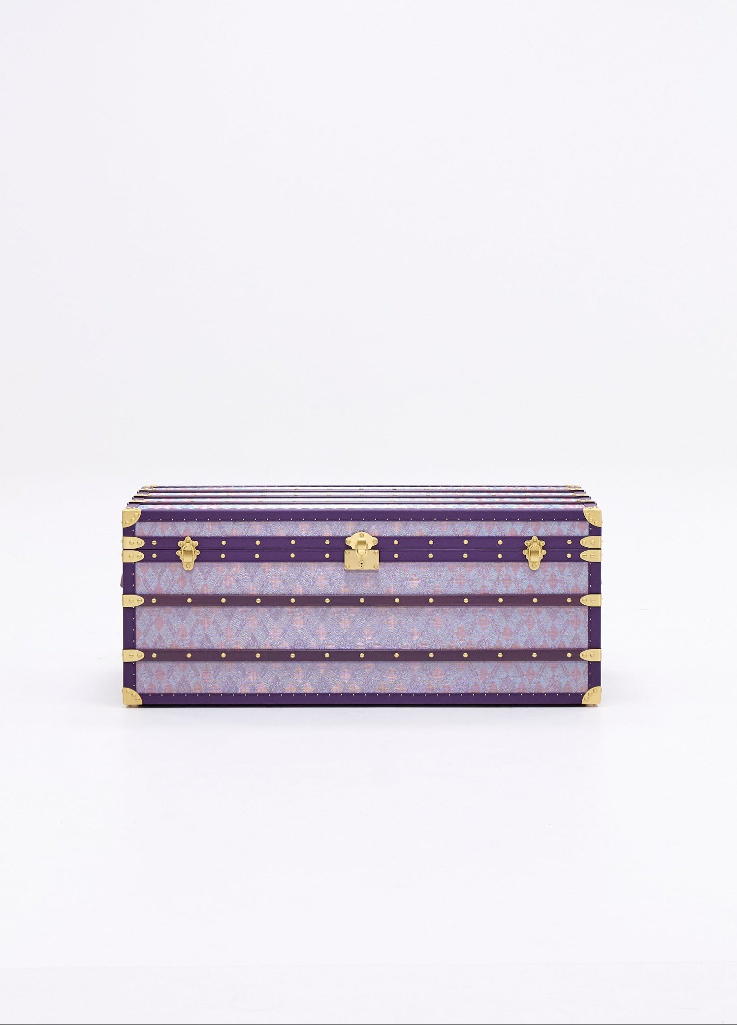 A purple coffee table case with a geometric pattern and copper wire detailing, closed and secured with a padlock.