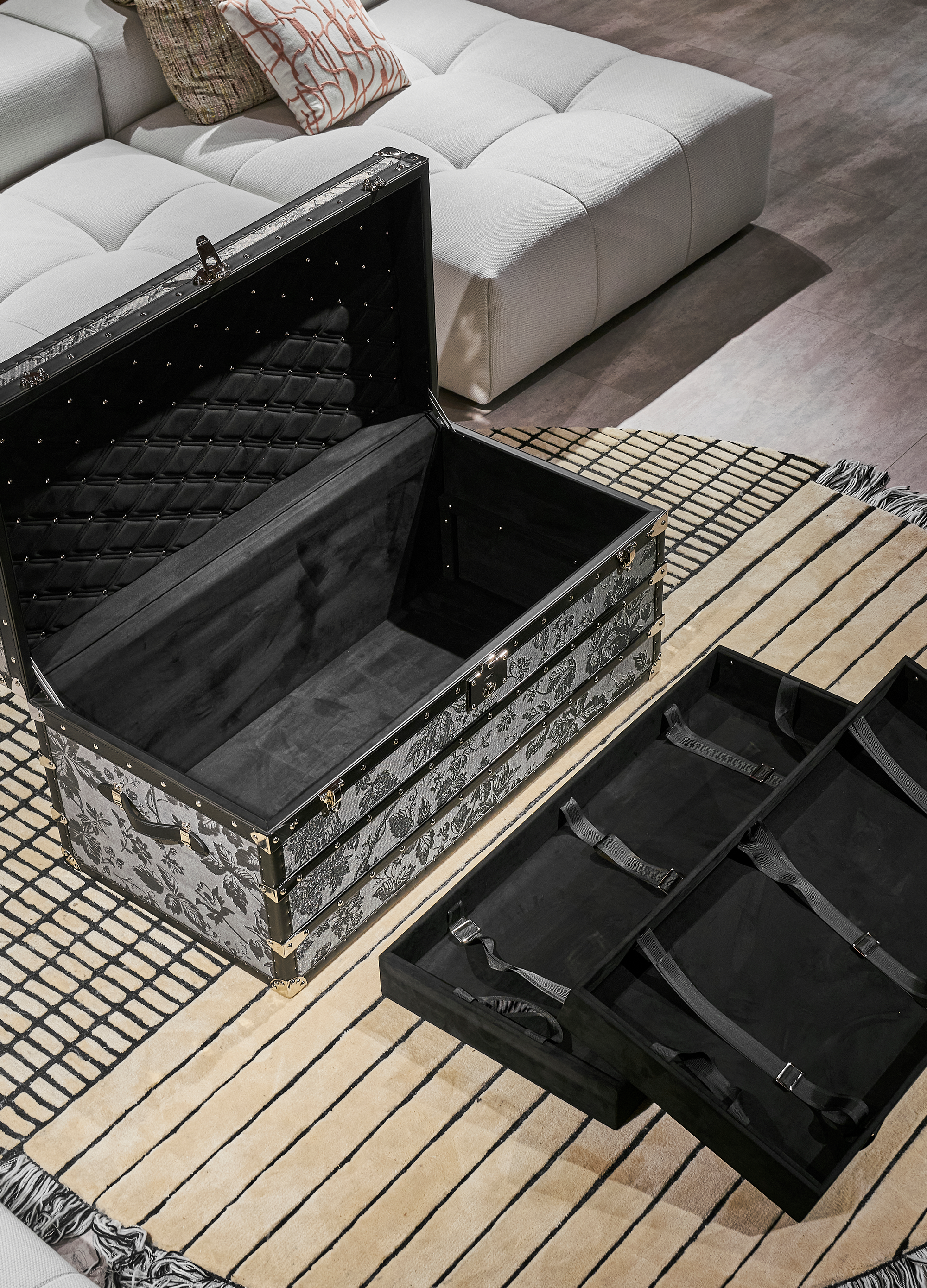 Monochrome microfiber leather storage trunk coffee table styled in a luxury Dubai interior by SIRAE