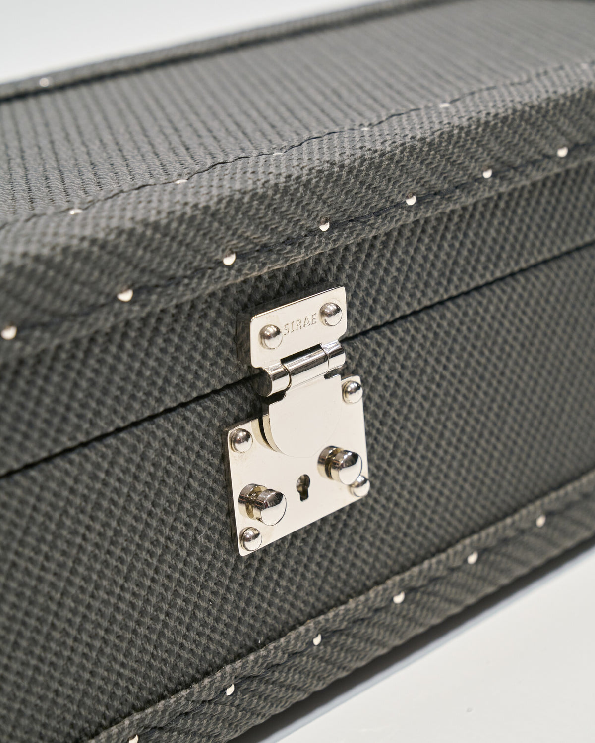 Hardware and finish detail on the black microfiber leather lockable ring and jewellery box, SIRAE Dubai