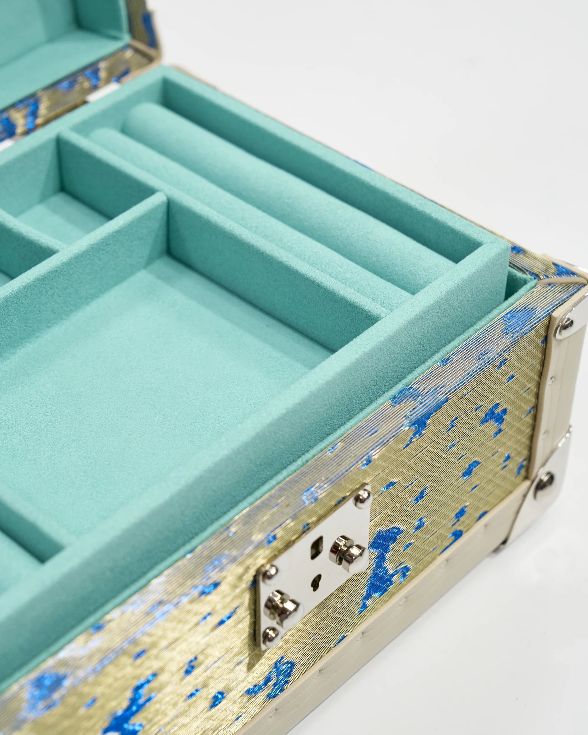 Velvet-lined interior of the SIRAE Aurum Loom gilded treasure jewelry box, styled for luxury storage