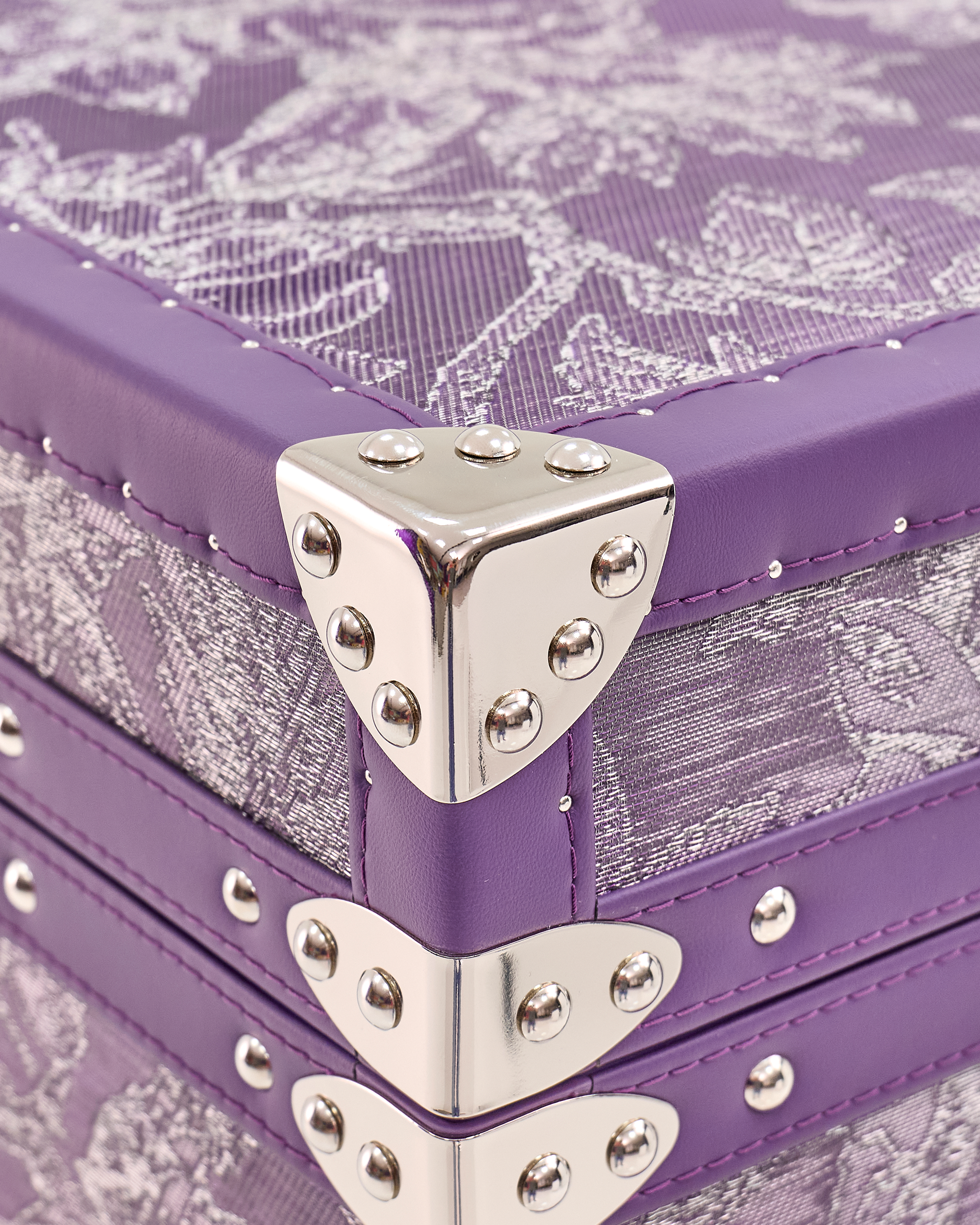 Velvet-lined interior of the SIRAE Aurum Loom royal amethyst jewelry trunk, styled for luxury storage