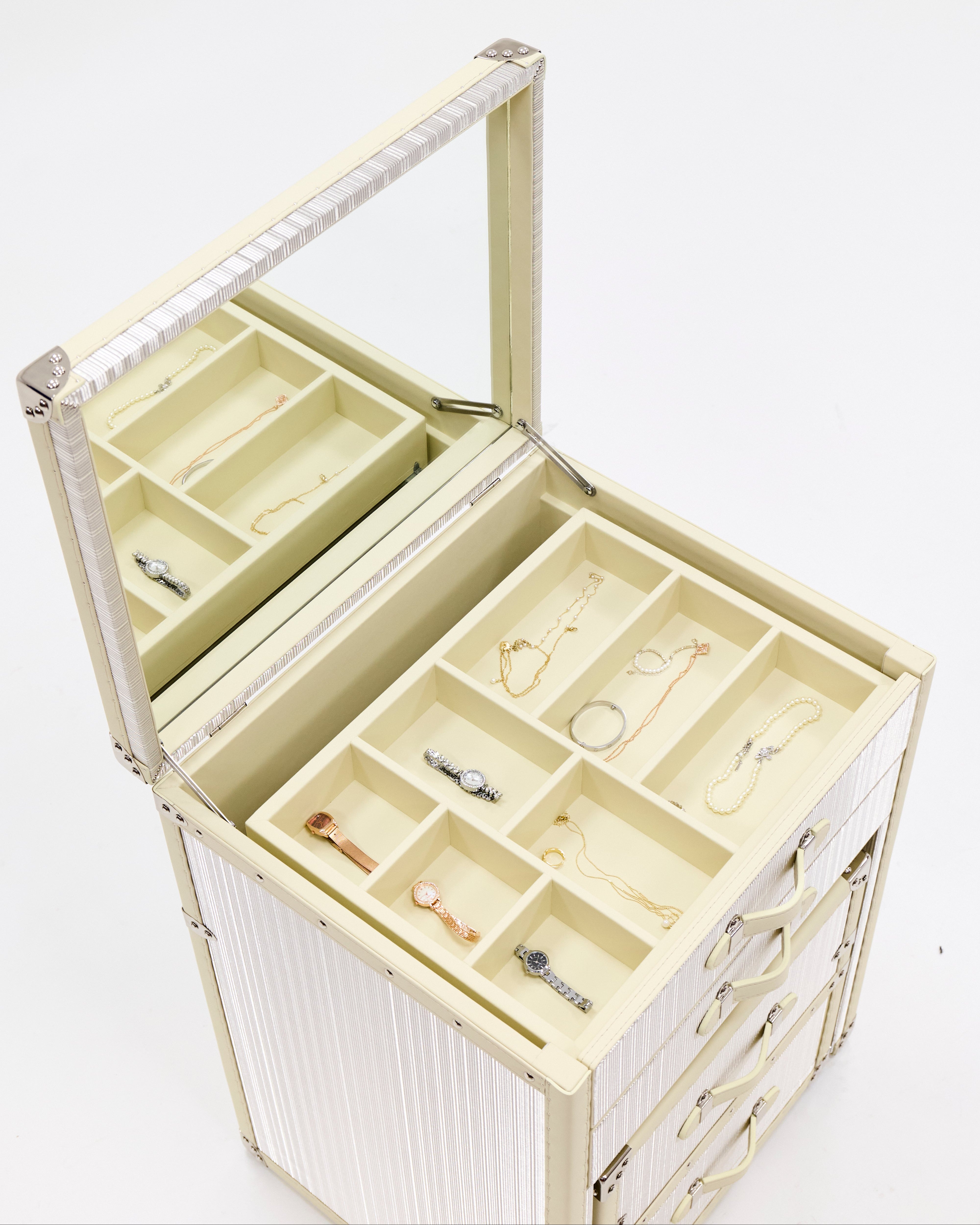 Velvet-lined interior of the SIRAE Aurum Loom gilded white vanity cabinet, styled for luxury storage