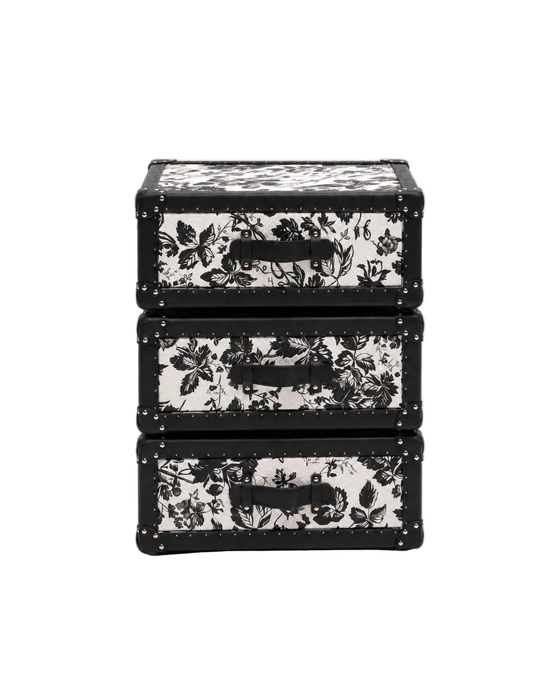 Three stacked rectangular storage boxes with black floral toile-style prints on a white background, featuring black handles and metal corner rivets, photographed on a light gray studio background.