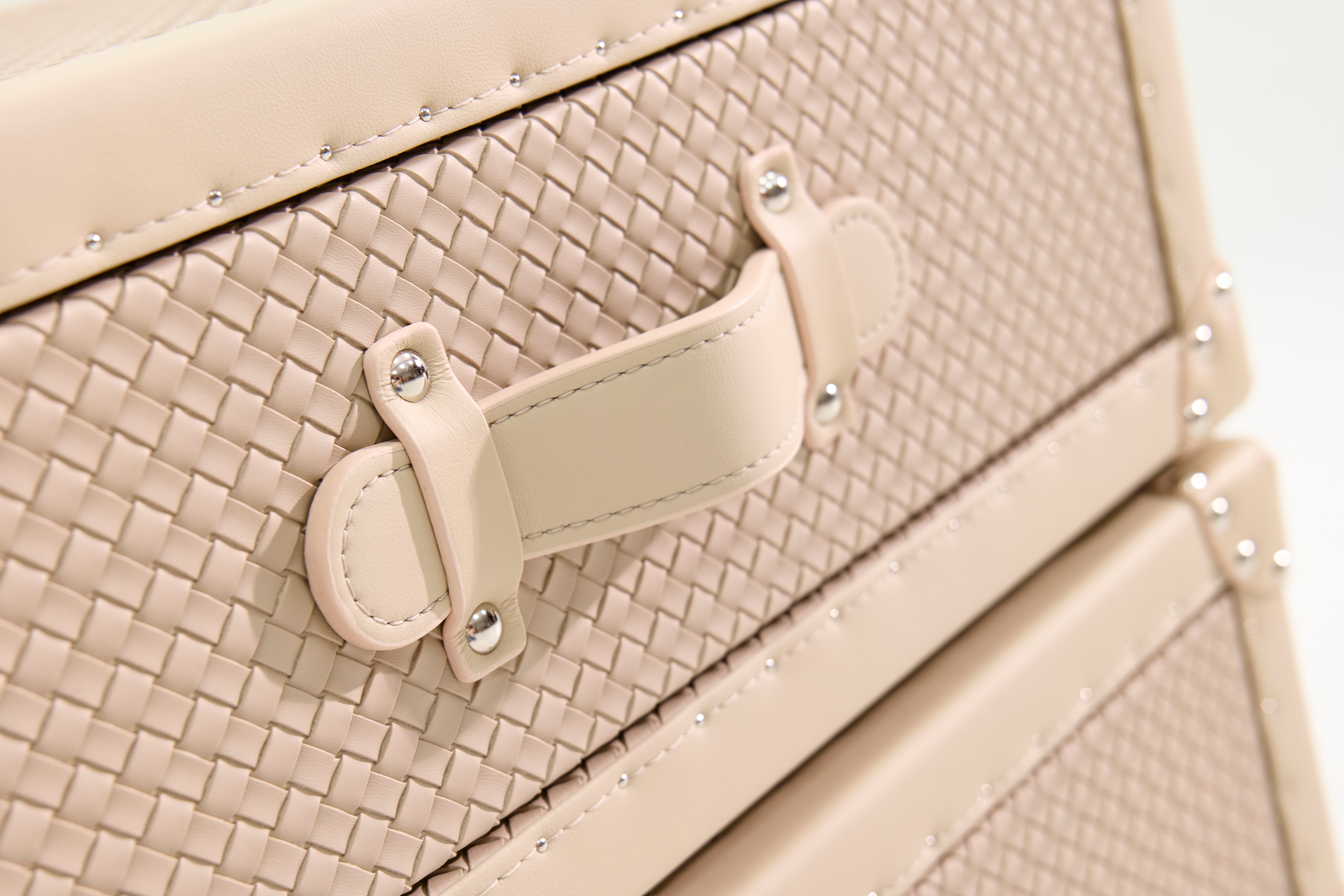Velvet-lined interior of the SIRAE Cuir Luxe cream rotating cabinet, styled for luxury storage