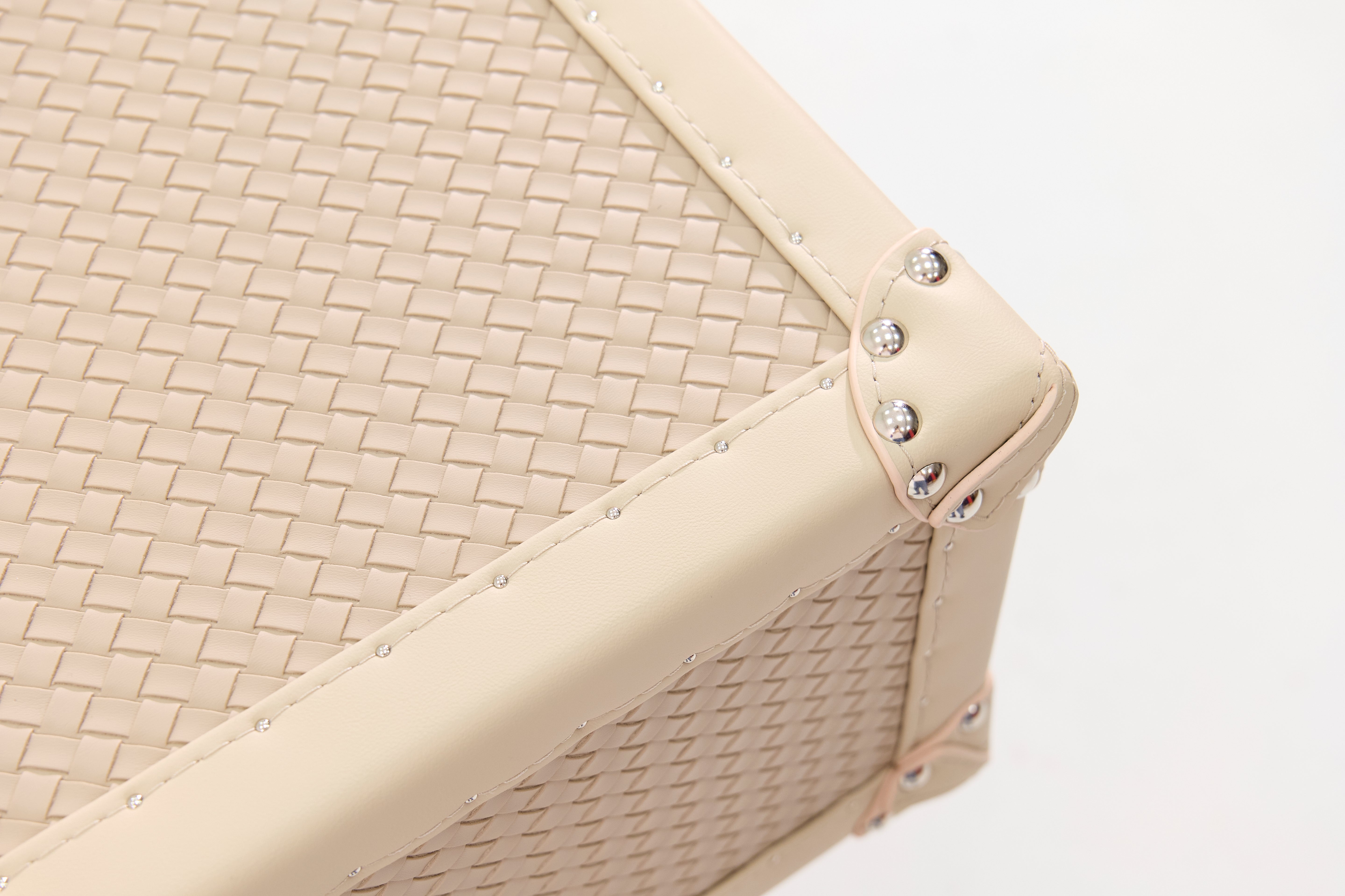 Side view of the SIRAE Cuir Luxe cream rotating cabinet in a luxury Dubai setting