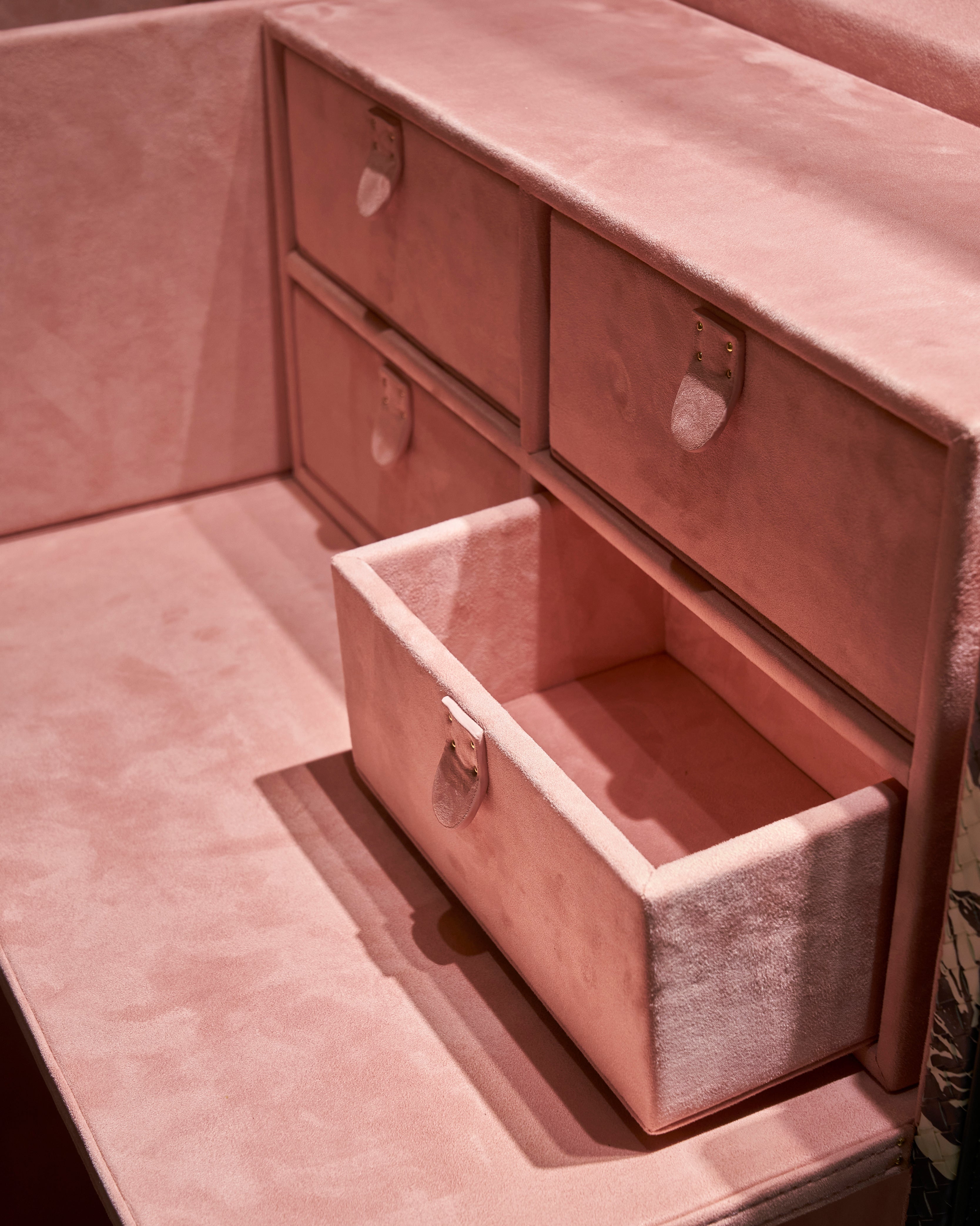 SIRAE Cuir Luxe blossom pink vanity cabinet styled with jewelry in a luxury Dubai interior