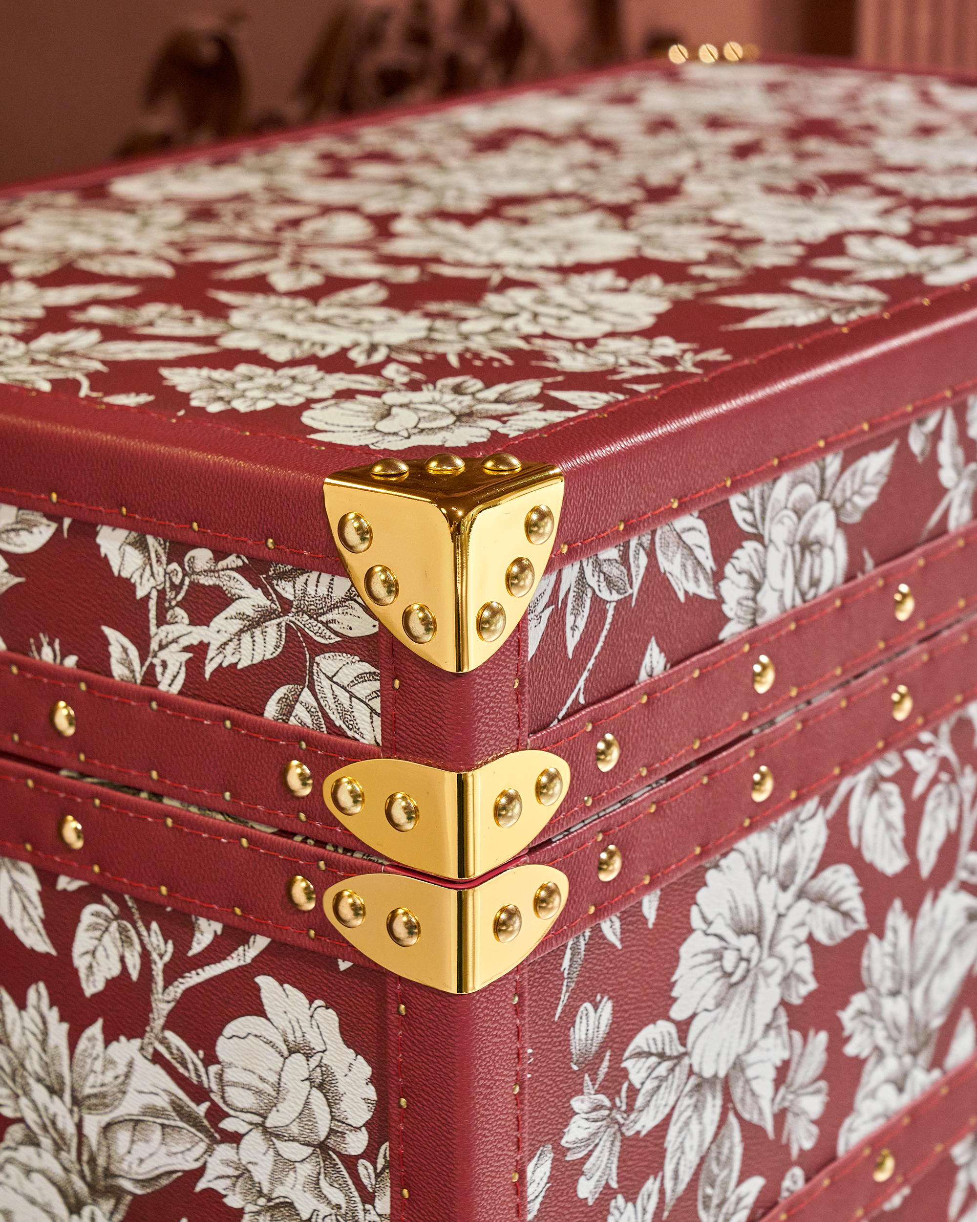 Velvet-lined interior of the SIRAE Heritage Luxe red floral print jewelry trunk, styled for luxury storage