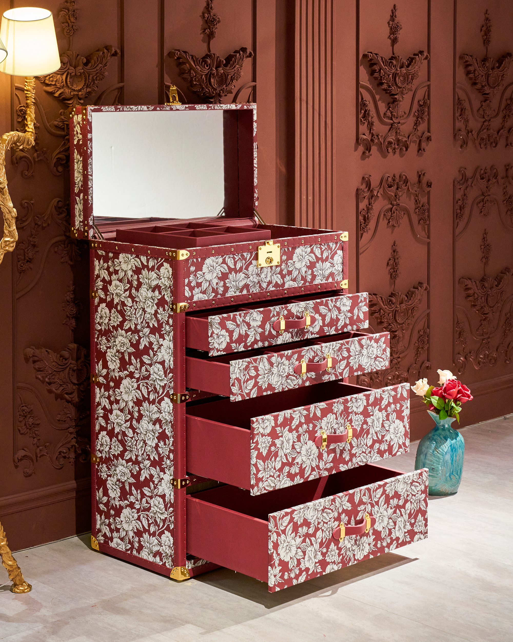 Open view of the red floral print leather jewelry trunk by SIRAE Dubai, showing biometric jewelry cabinet