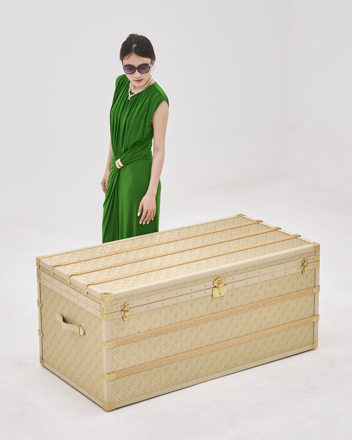 Hardware and finish detail on the antique gold woven copper wire coffee table storage trunk, SIRAE Dubai
