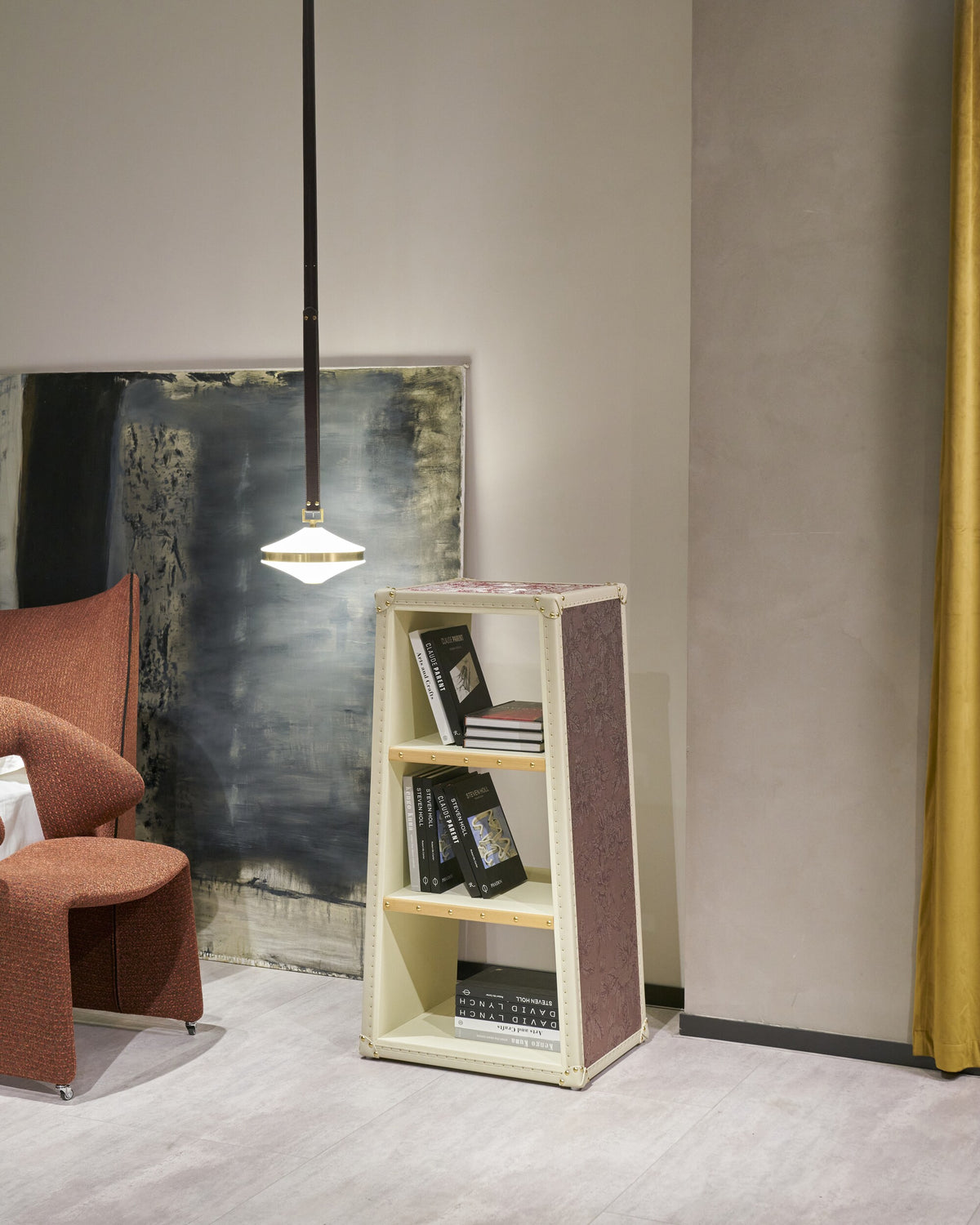 Open display cabinet beside a lounge chair, SIRAE Dubai