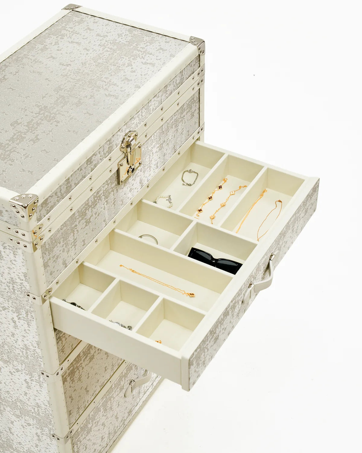 Jewelry and personal treasures arranged in a Pearl White Aurum Wire cabinet
